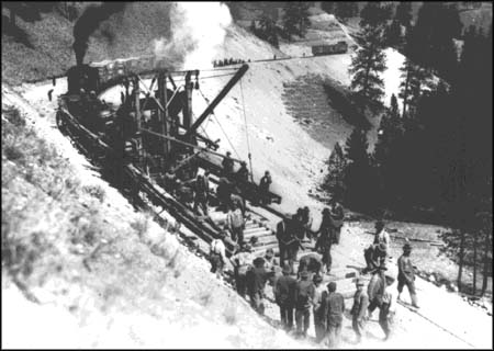 Track laying machine and rail gang